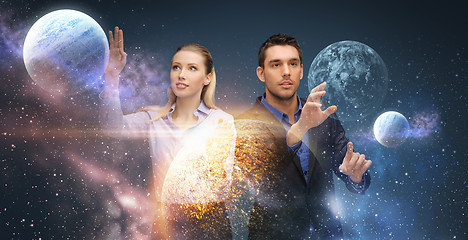 Image showing businessman and businesswoman over space