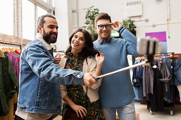 Image showing friends taking selfie at vintage clothing store