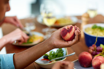 Image showing male hand holding peach