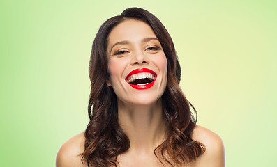 Image showing beautiful laughing young woman with red lipstick