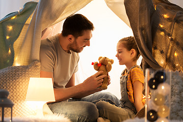 Image showing happy family playing with toy in kids tent at home