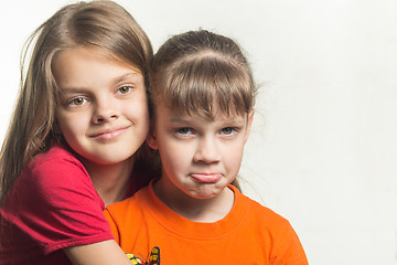 Image showing Portrait of two sisters with different characters