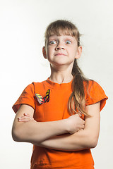 Image showing A lapel portrait of a gay little girl with funny eyes bulging