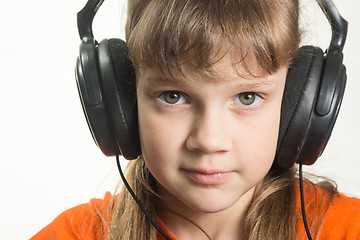 Image showing Portrait of a purposeful girl with headphones