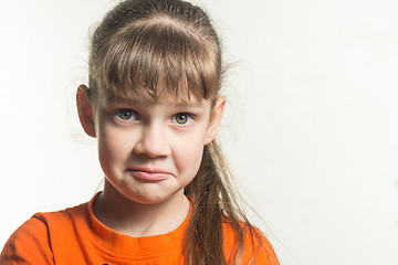 Image showing Portrait of a funny emotional girl on a white background