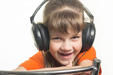 Image showing Portrait of a cheerful girl with headphones