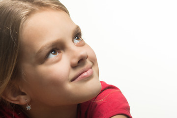 Image showing Close-up portrait of a girl who looked up