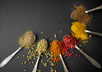 Image showing various spices on black background