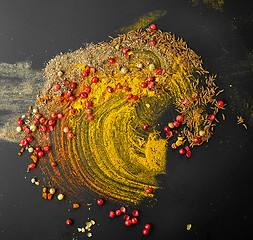 Image showing various spices on black background