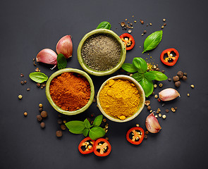 Image showing various spices on black background