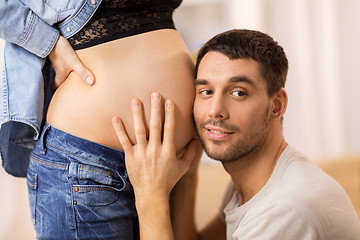 Image showing happy man touching pregnant woman belly