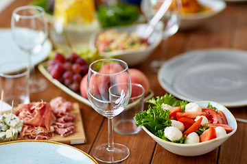 Image showing vegetable salad with mozzarella on wooden table