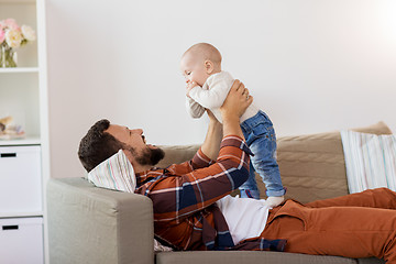 Image showing happy father with little baby boy at home