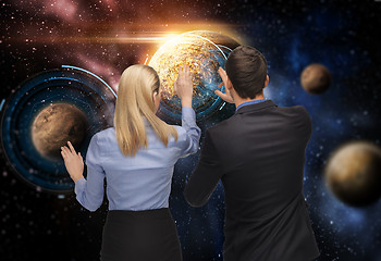 Image showing businessman and businesswoman over space