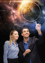 Image showing businessman and businesswoman over space