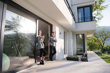 Image showing couple enjoying on the door of their luxury home villa