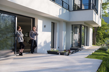 Image showing couple enjoying on the door of their luxury home villa