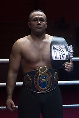 Image showing kick boxer with his championship belt