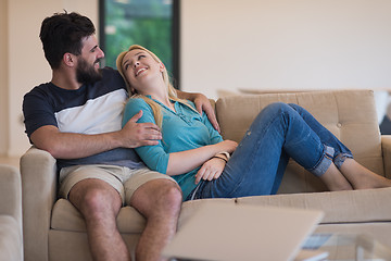 Image showing young happy couple relaxes in the living room