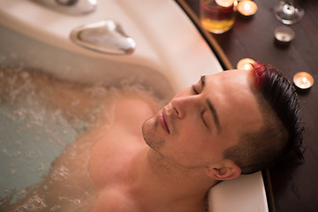 Image showing man relaxing in the jacuzzi