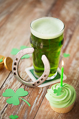 Image showing glass of beer, cupcake, horseshoe and gold coins