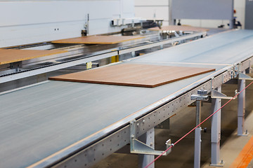 Image showing chipboards on conveyer at furniture factory