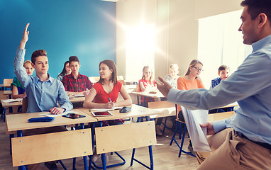 Image showing group of students and teacher with papers or tests