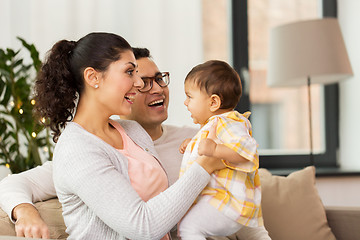 Image showing happy family with baby daughter at home