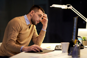 Image showing man with computer working late at night office