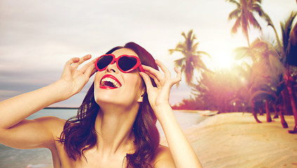 Image showing woman with red lipstick and heart shaped shades