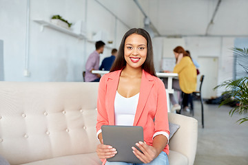 Image showing happy asian woman with tablet pc working at office