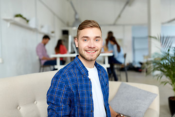 Image showing happy creative male worker at office or student