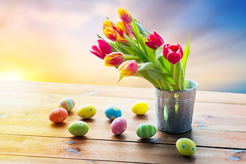 Image showing close up of easter eggs and flowers in bucket