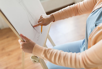 Image showing artist with pencil drawing picture at art studio