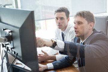 Image showing Business team analyzing data at business meeting.