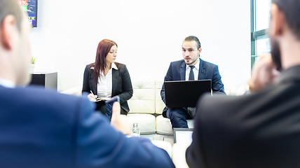 Image showing Business people sitting at working meeting in modern corporate office.