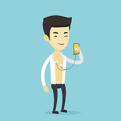 Image showing Man measuring heart rate pulse with smartphone.