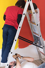 Image showing boys painting wall