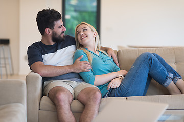 Image showing young happy couple relaxes in the living room