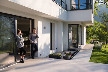 Image showing couple enjoying on the door of their luxury home villa