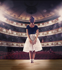 Image showing Baby girl dreaming a dancing ballet on the stage. Childhood concept.