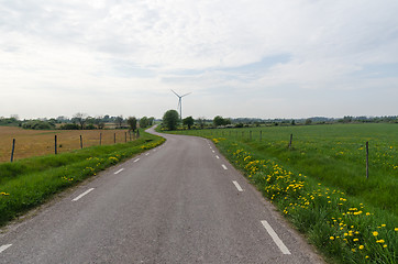 Image showing Country road by a wind turbine