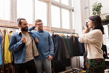 Image showing friends photographing at vintage clothing store