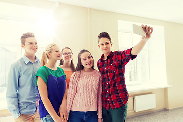 Image showing group of students taking selfie with smartphone