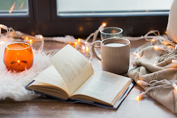 Image showing book and coffee or hot chocolate on window sill