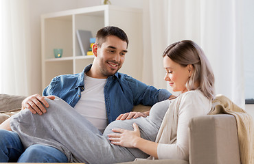 Image showing happy man with pregnant woman at home