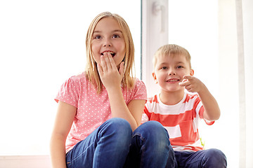 Image showing surprised little kids at window