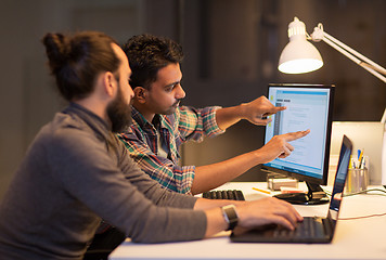 Image showing creative team with computer working late at office