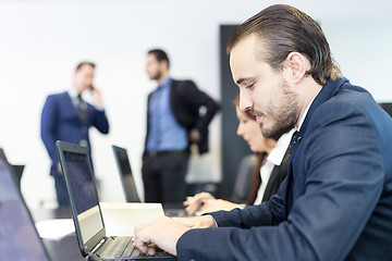 Image showing Business people in modern corporate office.