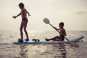 Image showing Happy children playing on the beach at the day time.